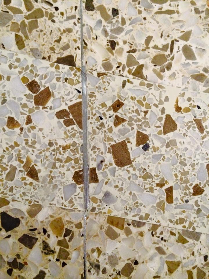 Professional travertine restoration showing filled holes and polished surface in Kansas City